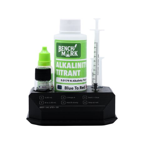 Open Benchmark Alkalinity Test Kit with reagents and syringes arranged in the stand